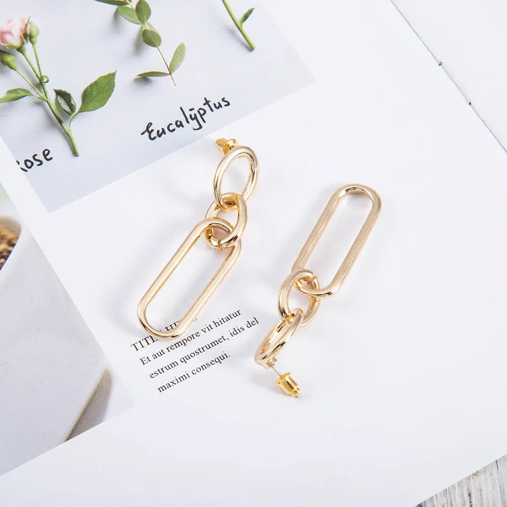 Sterling silver needle coloured geometric hoop earrings for women with ring and line design.
