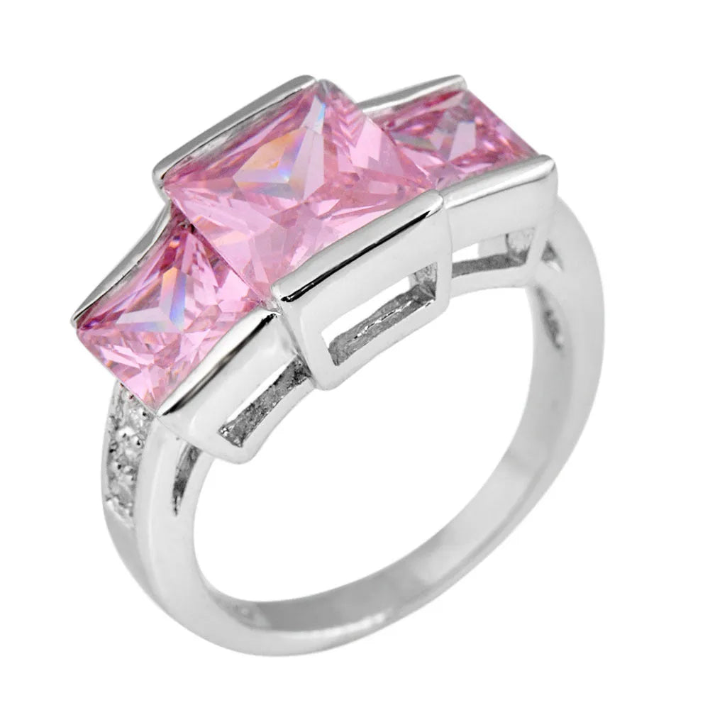 Women's geometric rainbow metal ring in electroplated copper showing colour options.