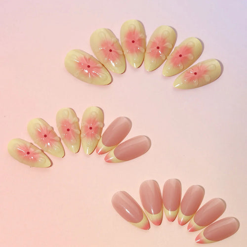 Cartoon-style plastic fake nails with 3D raised pink flowers, shown with jelly glue and a nail file.
