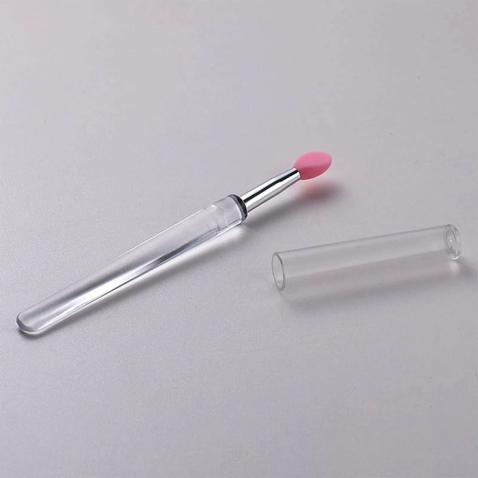 Set of reusable silicone lip brushes with protective caps in various colours