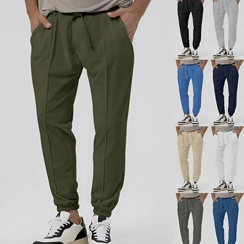 Men's grey casual tapered sweatpants with an elasticated waistband laid flat.