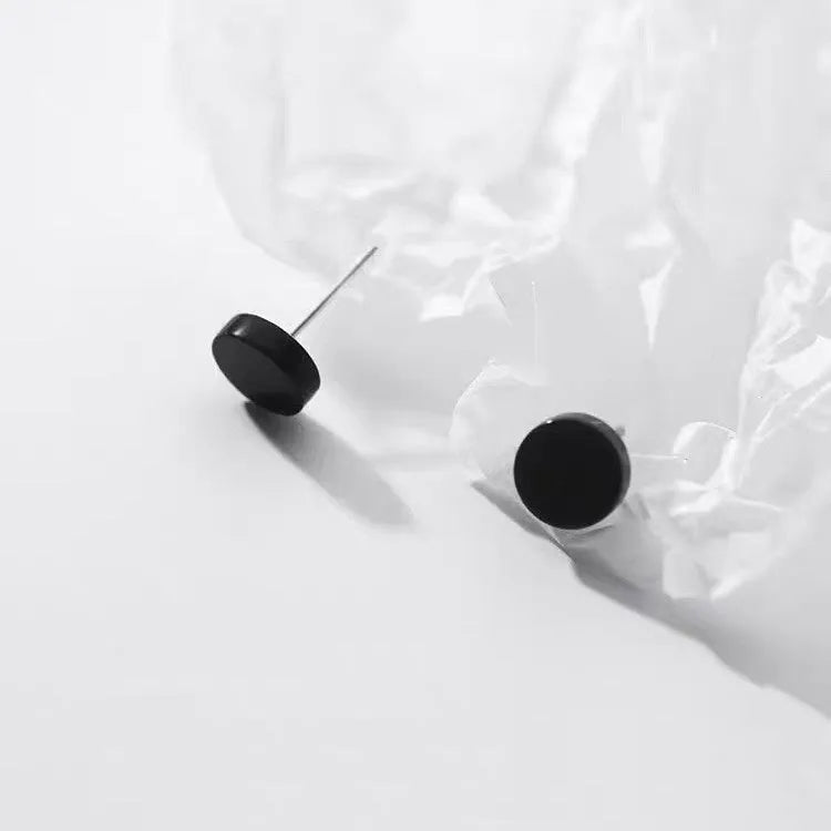Sterling silver S999 flat ear bone studs in round geometry shape showing silver and black colour options