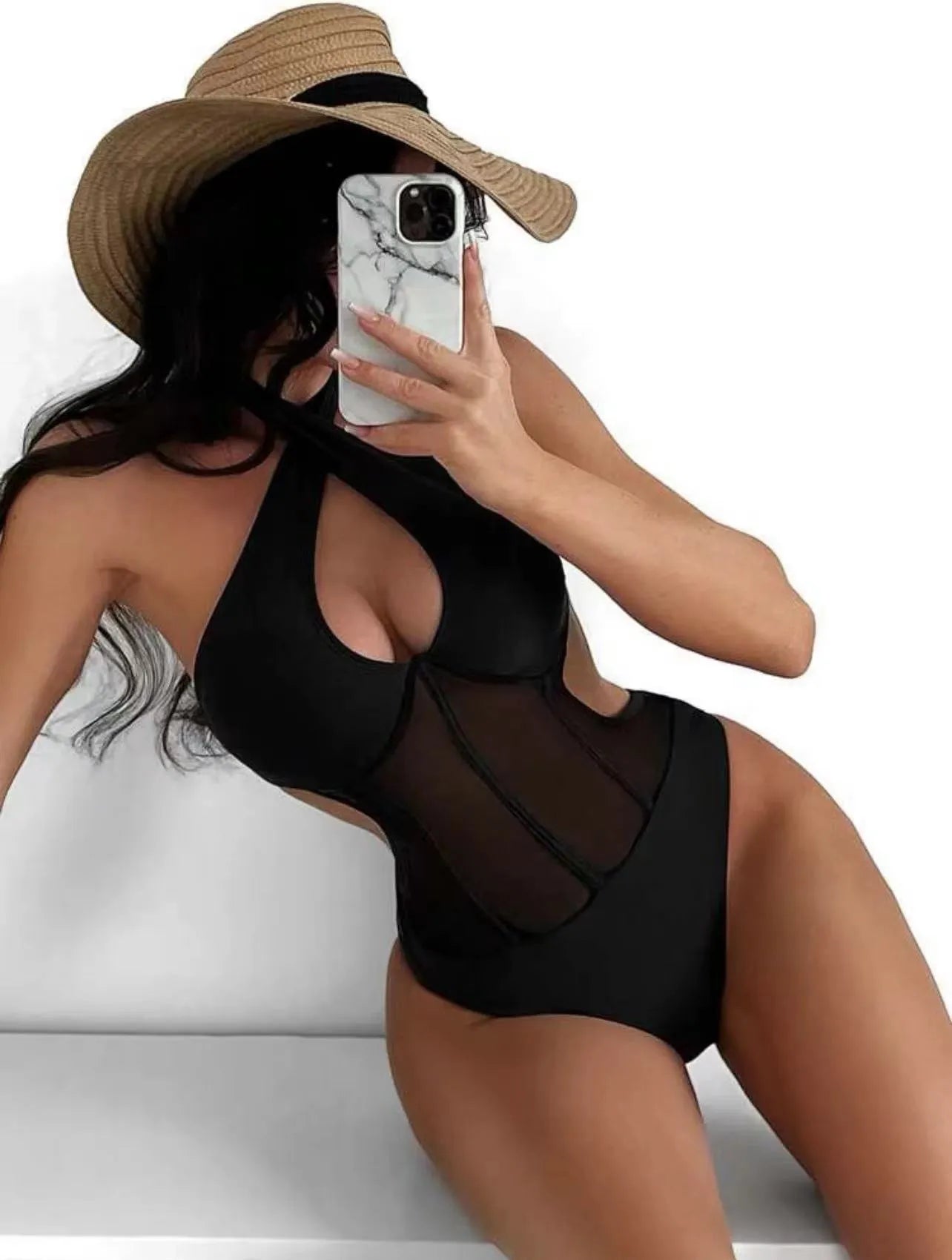 Women's black one-piece swimsuit bikini made from nylon and spandex fabric on a mannequin.