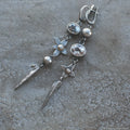 Pair of Hesheng geometric long drop earrings with antique silver XINGX pendant and rhinestones.