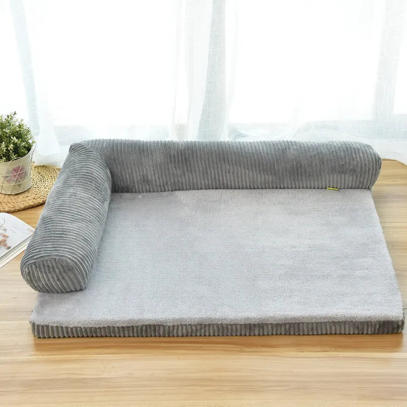 Corduroy fabric pet sofa dog bed in a grey colour, showing raised sides and plush high-density sponge padding.