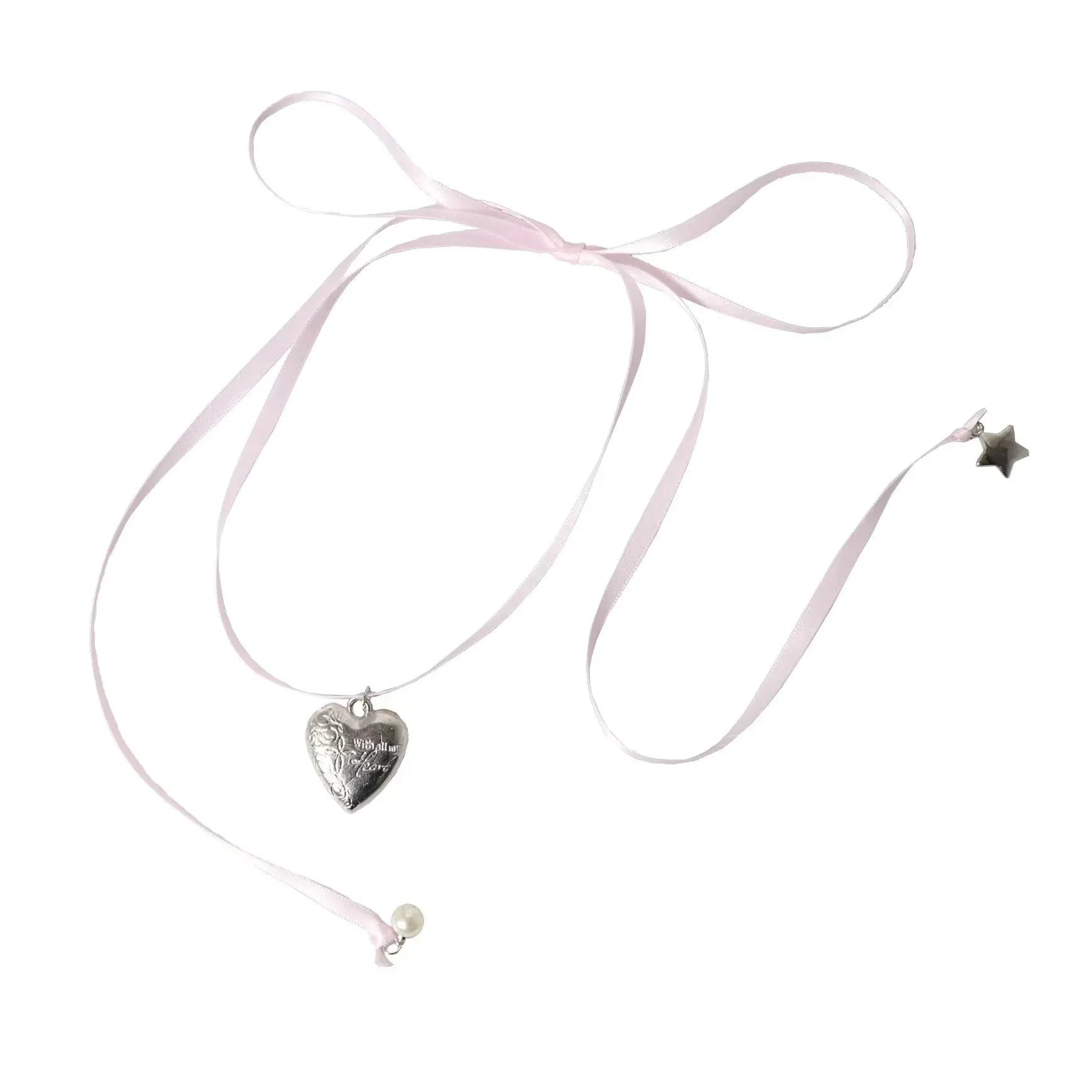Close-up of a women's alloy necklace with a ribbed heart pendant on a clavicle-length chain.