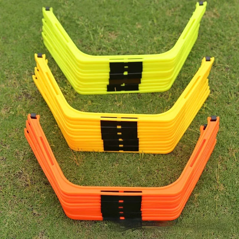 Set of six foldable yellow, green, and orange hexagon plastic agility rings for football training.