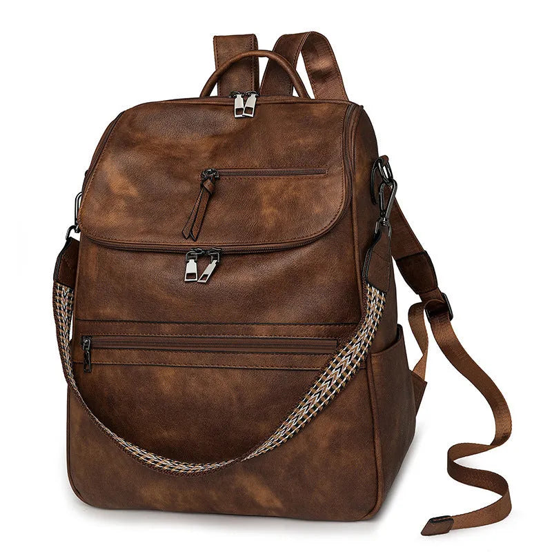 Retro college backpack in PU material with a curved shoulder strap shown in multiple colour options.