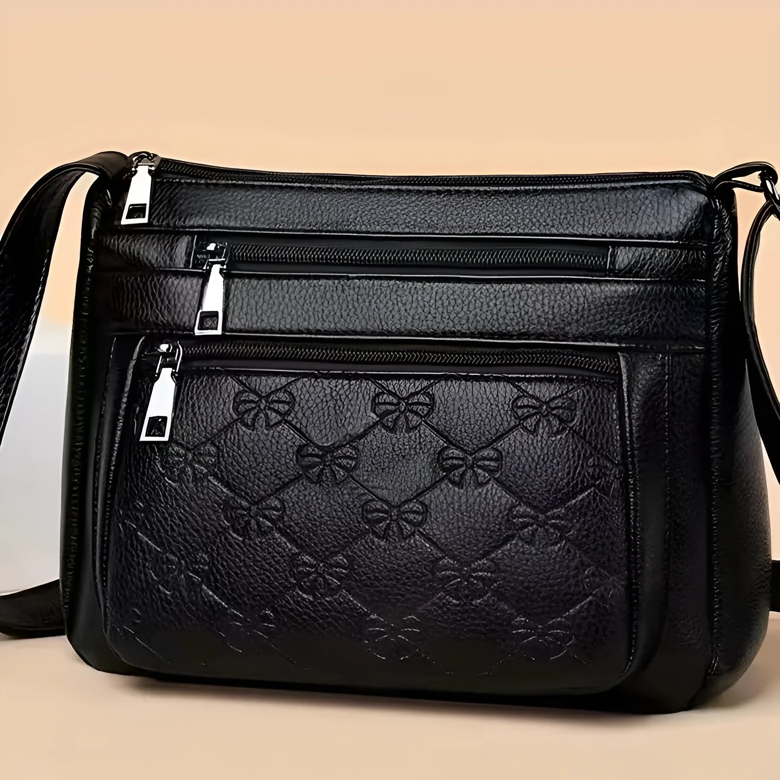 Butterfly black PU leather women's crossbody messenger bag showing embossed pattern and horizontal square shape