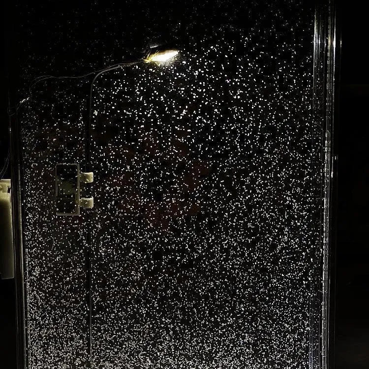 DIY material kit for assembling a snowy landscape night light with small street lamp and LED lights.