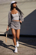 Women's grey hooded jacket and matching miniskirt casual streetwear outfit