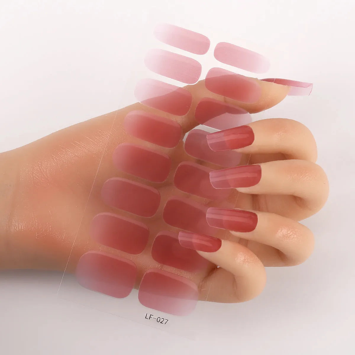 Sheet of 16 solid colour nail art sticker designs including cross, rose, and leopard print patterns.