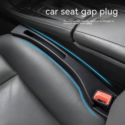 Black car gap storage box with handle positioned between car seats