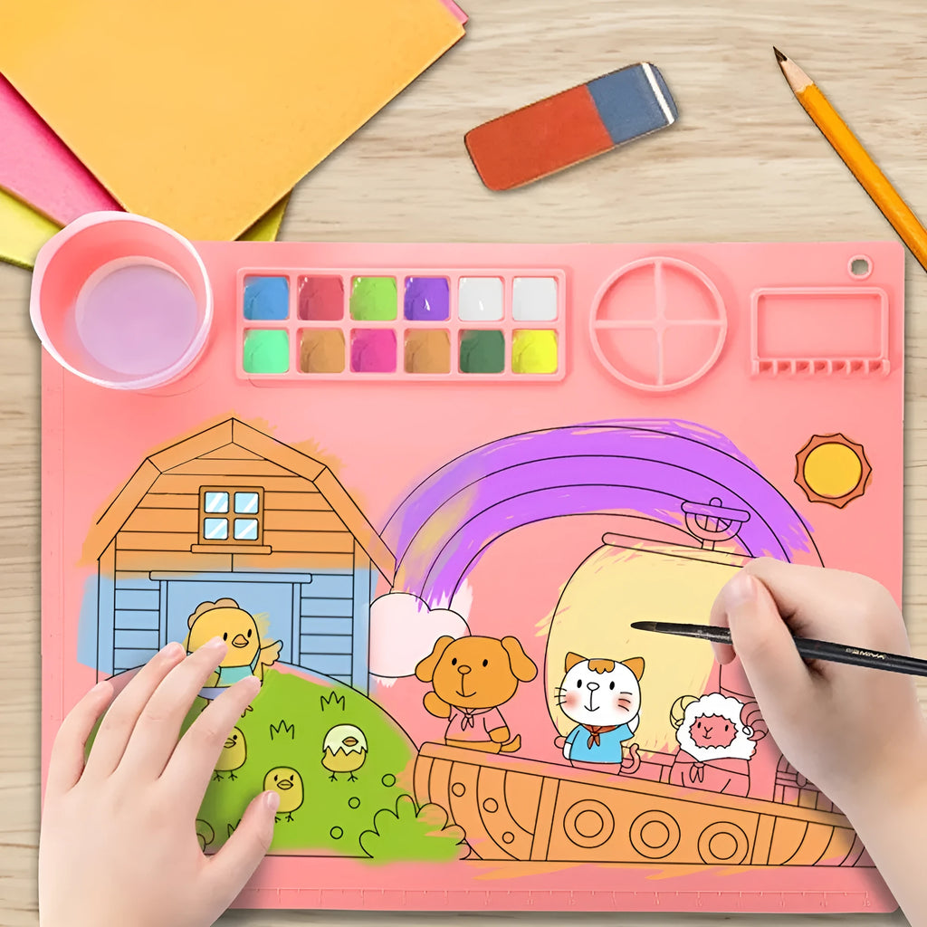 Light blue silicone painting mat with two round bowls on a 50cm by 40cm rectangular surface.