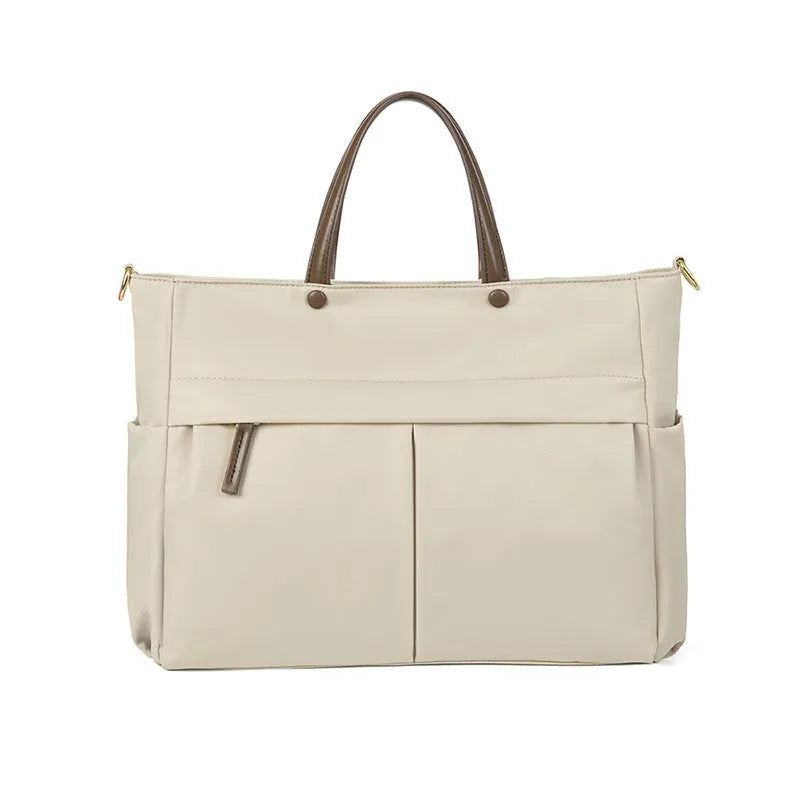 Portable oxford cloth laptop briefcase for women in elegant black with contrast stitching and large capacity.