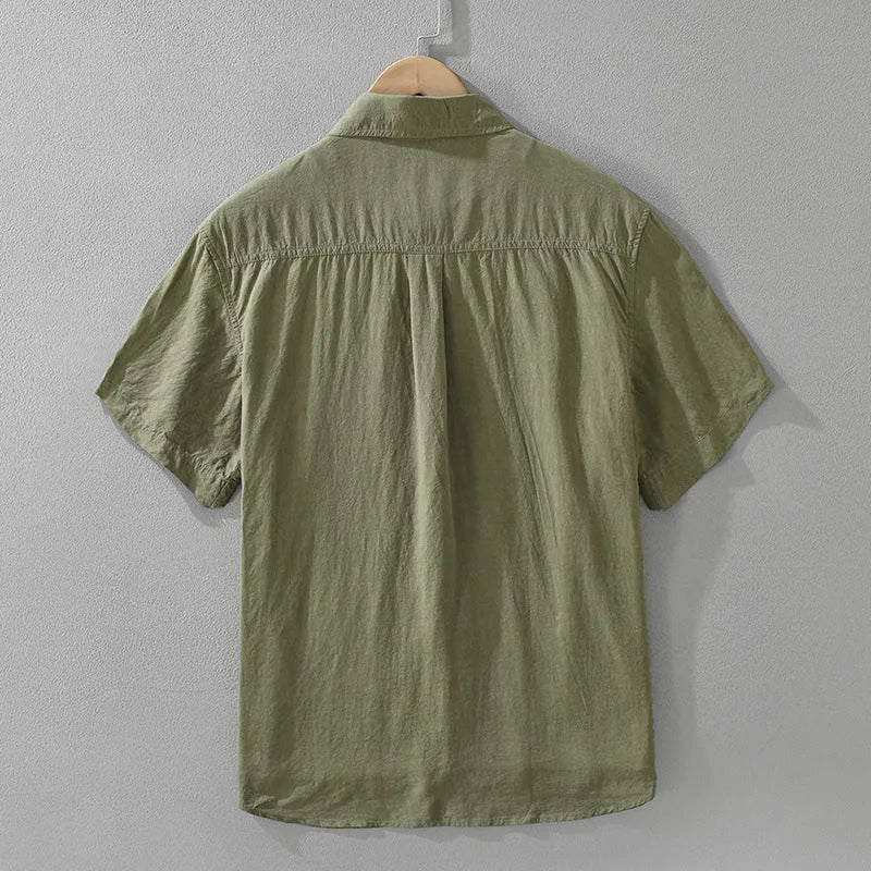 Women's loose black lyocell cardigan top with short sleeves on a hanger