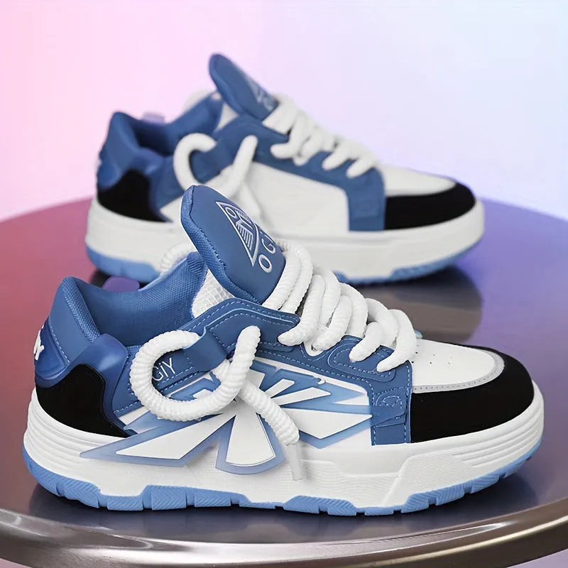 Men's white chunky sneakers with a cartoon totem pattern on the synthetic leather upper and a thick rubber sole.