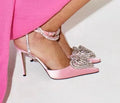 Women's pink satin sandals with pointed toe, heart-shaped rhinestone decoration, and ankle winding tape.