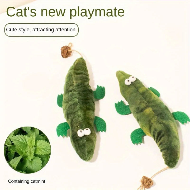 Green plush alligator cat toy with plant-based materials and peppermint scent for oral cleansing