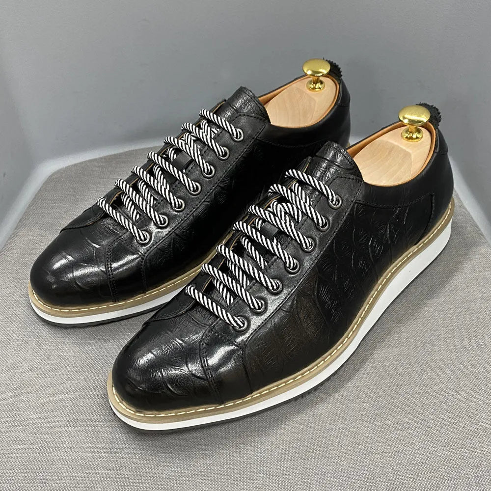 Men's handmade casual shoes with embossed pattern detailing and low tube front tie design