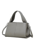Women's genuine leather messenger bag in horizontal square shape with double shoulder strap, shown in apricot colour.