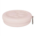 Collapsible silicone dog bowl in light pink and green colours showing portable feeding design
