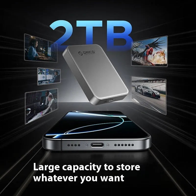 Grey magnetic mobile solid state drive with ultra-thin design next to C to C cable and magnetic suction ring