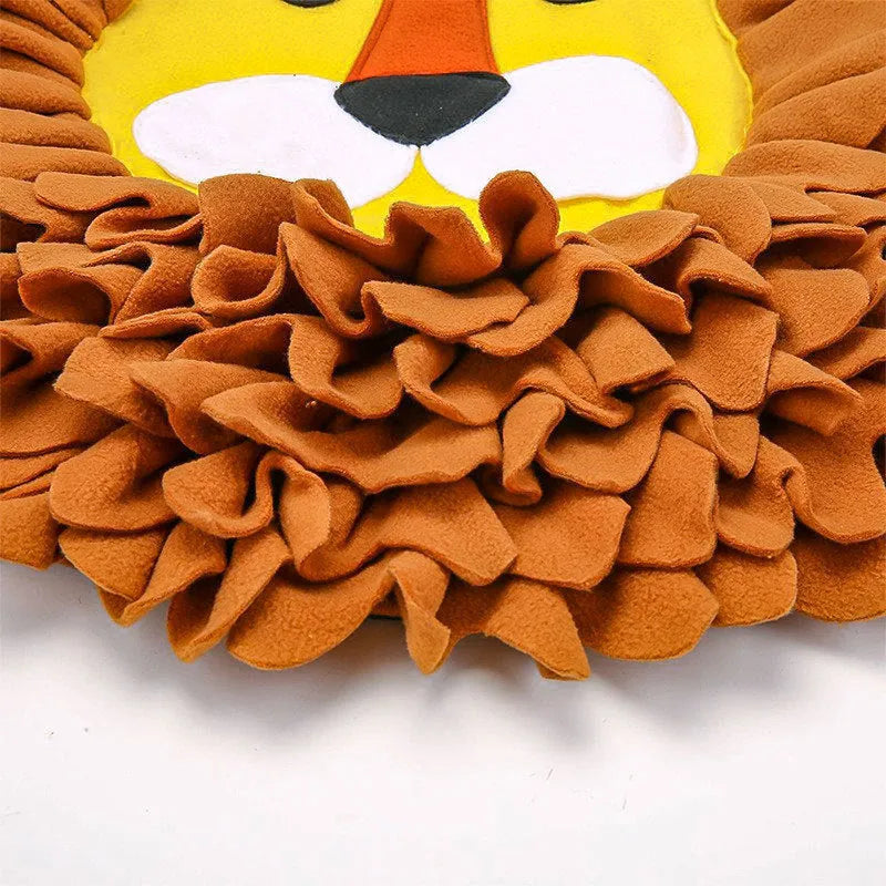 Brown lion face pattern snuffle mat for dogs and cats on a floor.