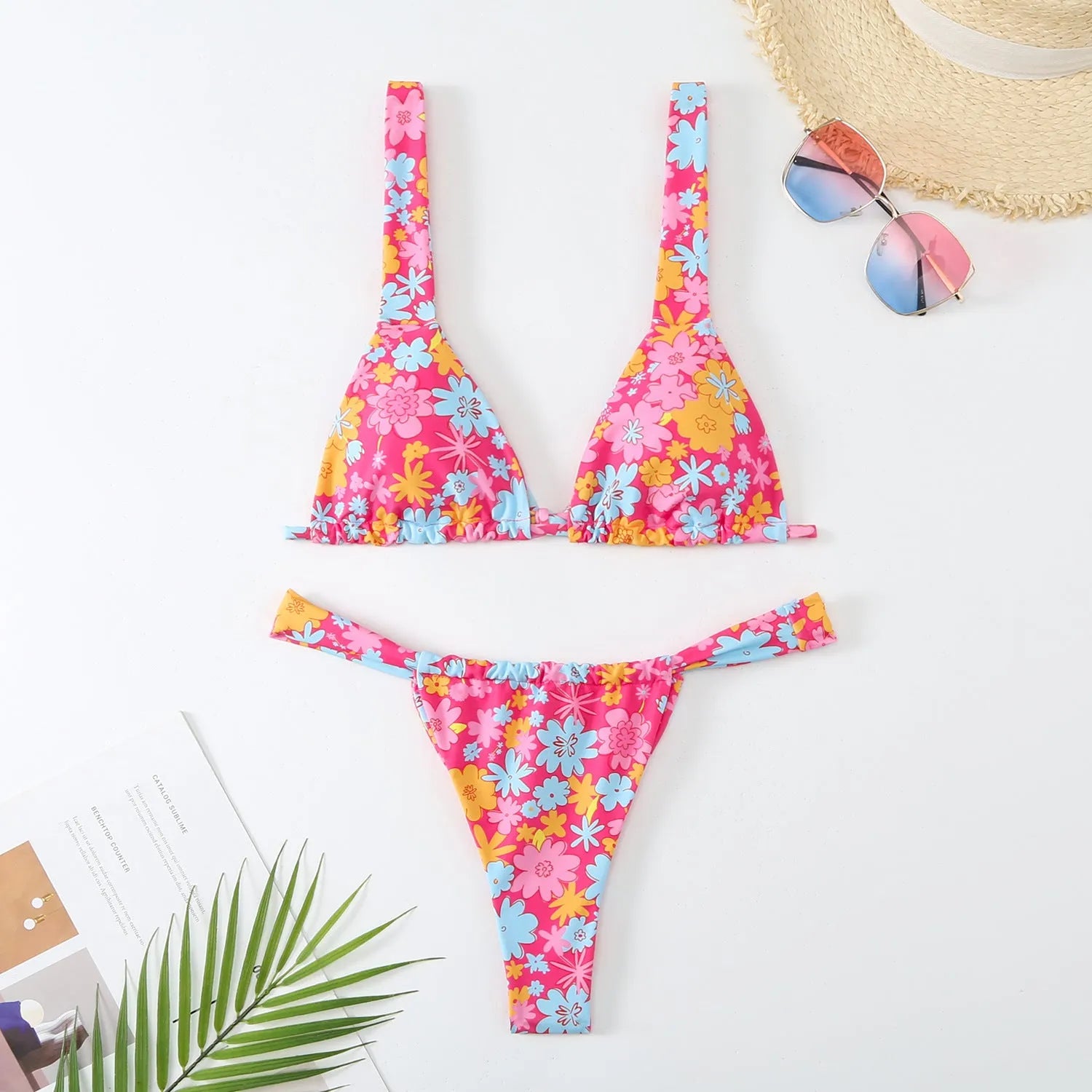 Women's floral printed bikini swimsuit two-piece set in blue on a mannequin.