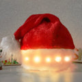 Red and white plush LED Santa hat with pom-pom and multi-coloured twinkling lights on.