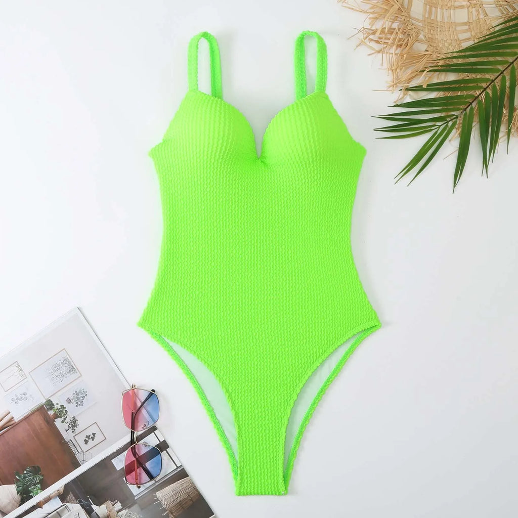 Women's black one-piece sleeveless swimsuit with a sunken stripe pattern on a mannequin.