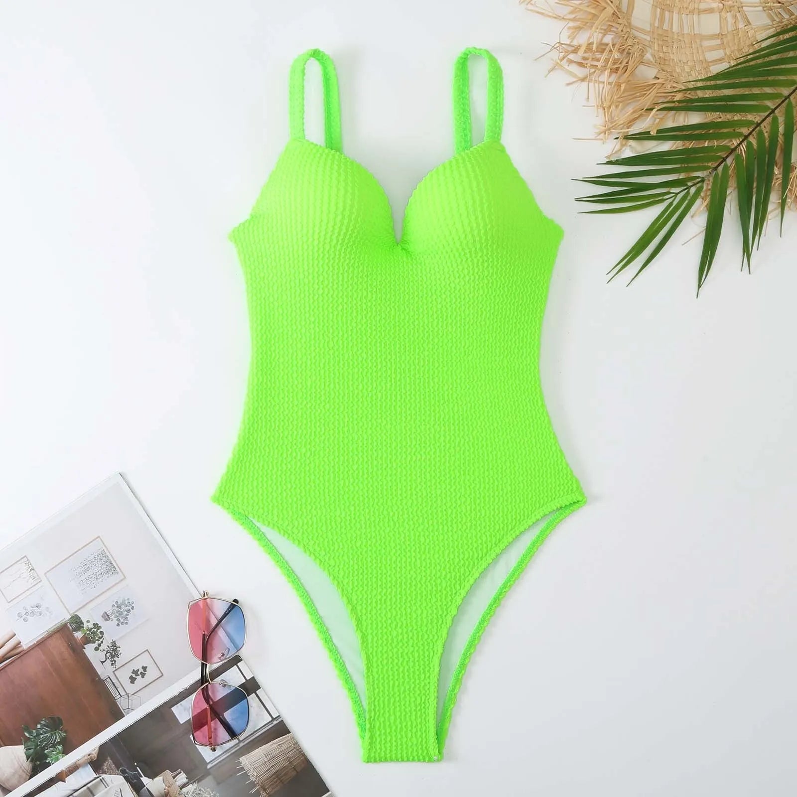 Women's black one-piece sleeveless swimsuit with a sunken stripe pattern on a mannequin.