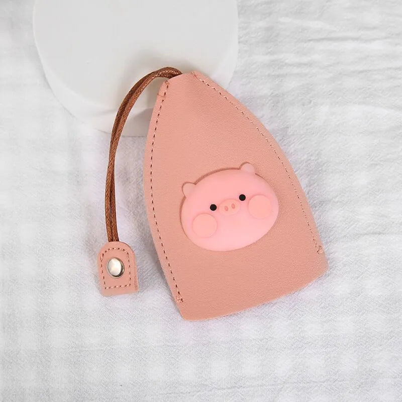 Cartoon pull-out car key case in PU leather with colourful designs measuring 14 x 7.5 cm