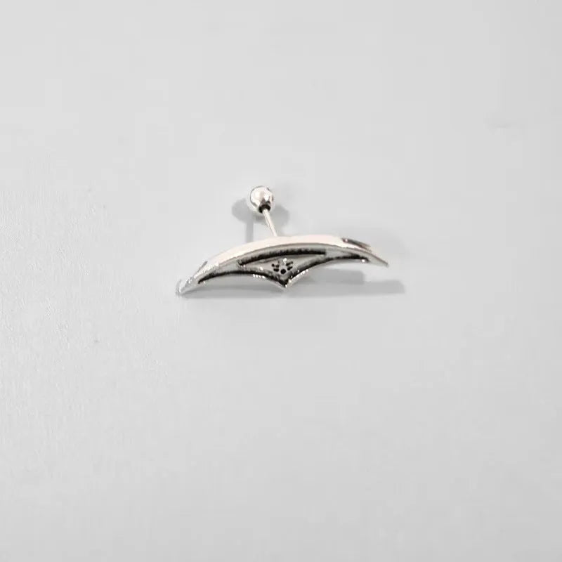 A pair of geometric spider web design stud earrings in an electroplated gold finish.
