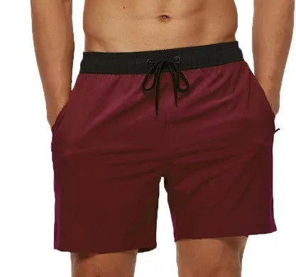Men's blue training shorts with stitching waist detail and headband pocket for running and fitness