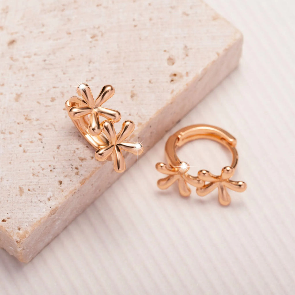 Circular rose gold earrings with waterdrop flower design for women