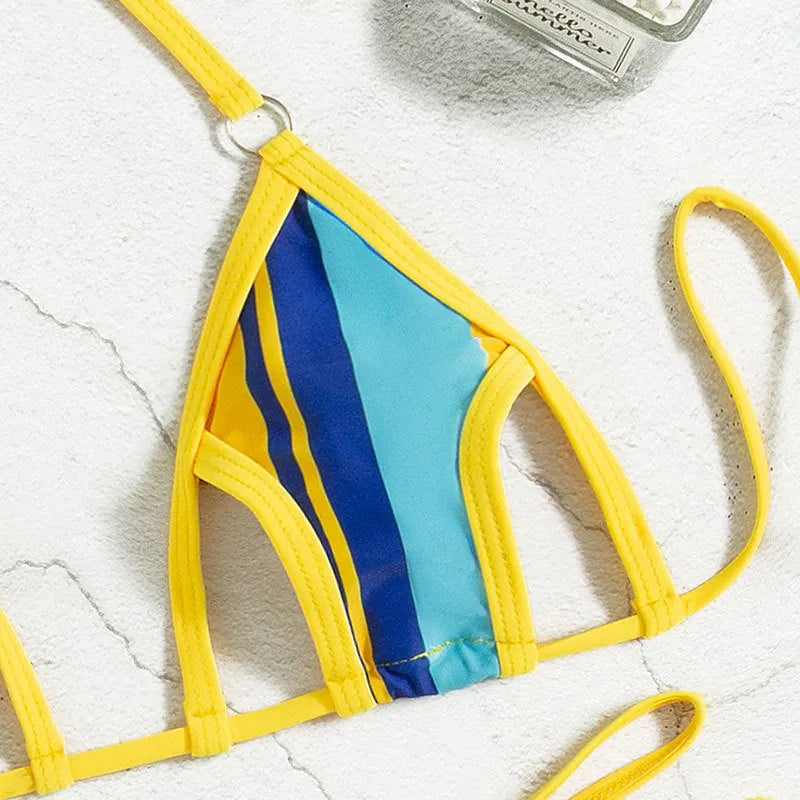 Yellow women's two-piece swimsuit with neck-hanging design, hollow backless top and high-waist shorts