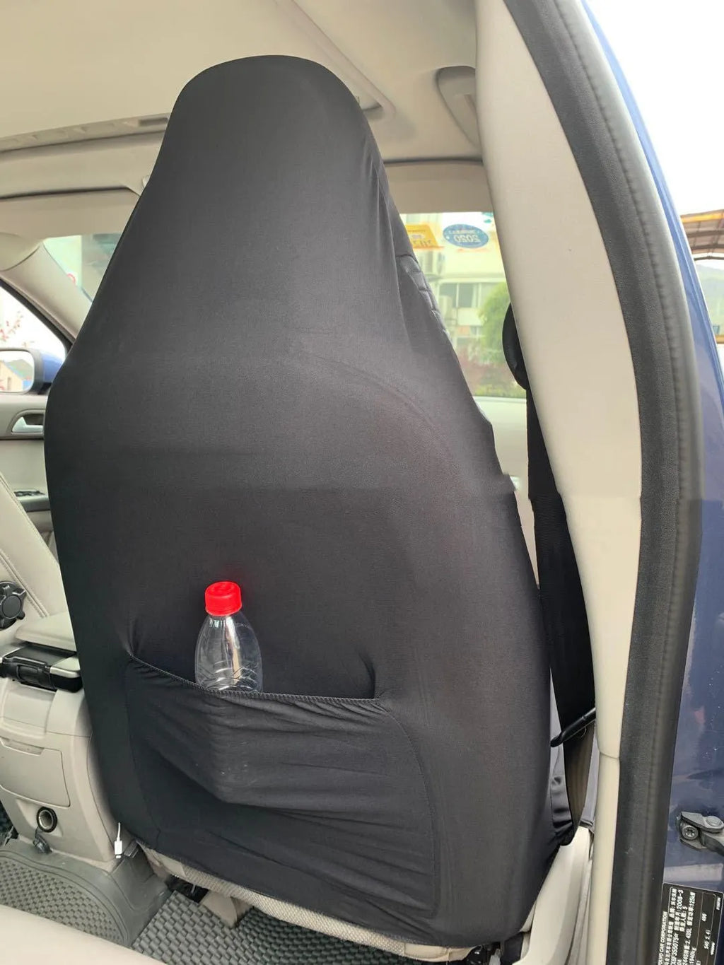 Black quilted universal car seat cover made from PU and polyester fabric with sponge composite.