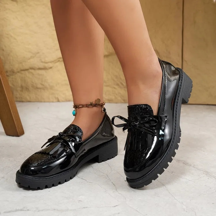 Women's black and brown bow loafers in artificial PU material with slip-on design for spring and autumn wear