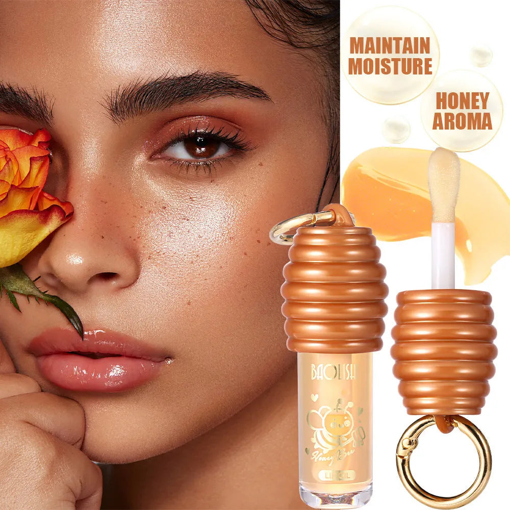 Honey Lip Gloss in a portable keychain case for moisturising and nourishing lips.