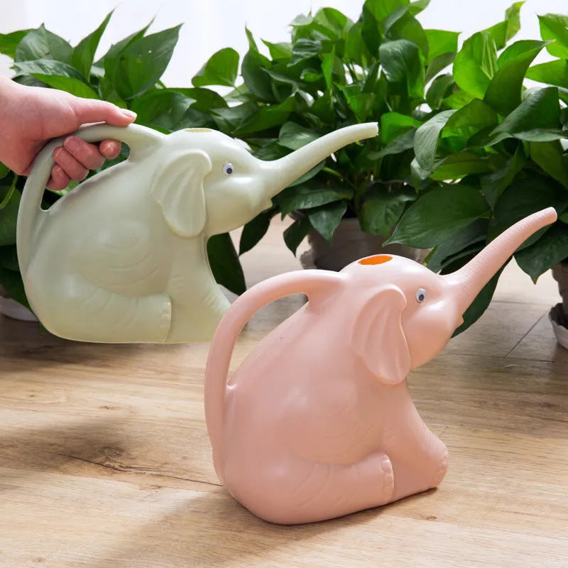 Pink children's elephant-shaped watering can with a long nozzle and baby bottle handle.