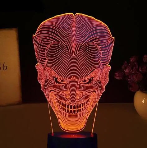 3D acrylic LED lamp on a base showing multi-colour gradient lighting, with a USB cable and remote control.