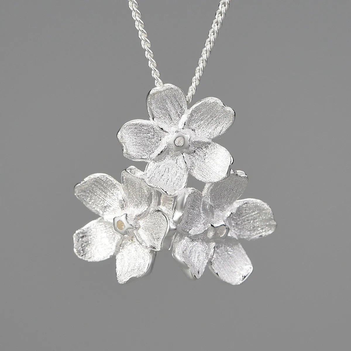 Myosotis Sylvatica forget-me-not flower sterling silver pendant with open mouth pastoral design