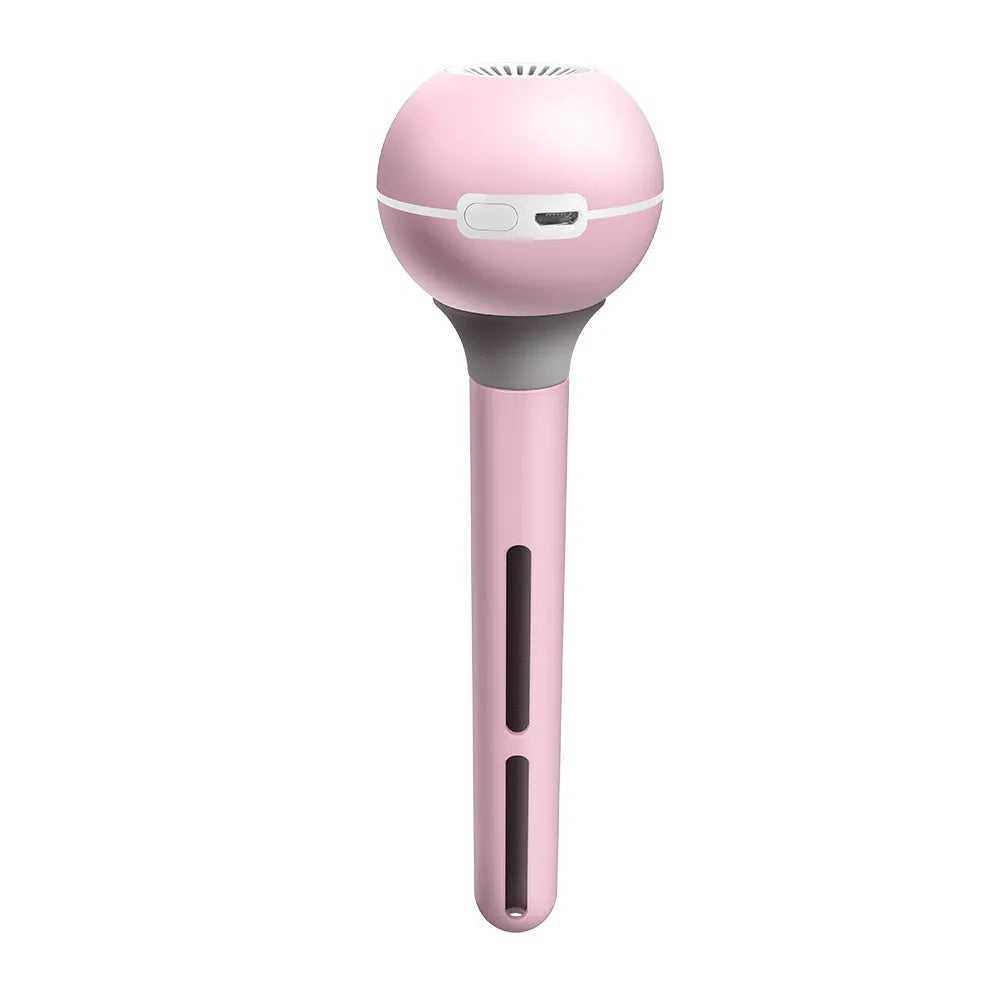 A columnar pink and white personal USB magic wand humidifier on a table.