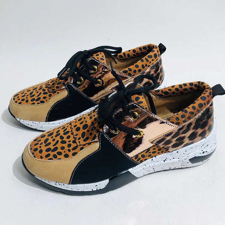 Women's casual suede sneakers with a wedge heel in various colours including black, pink, and leopard print.