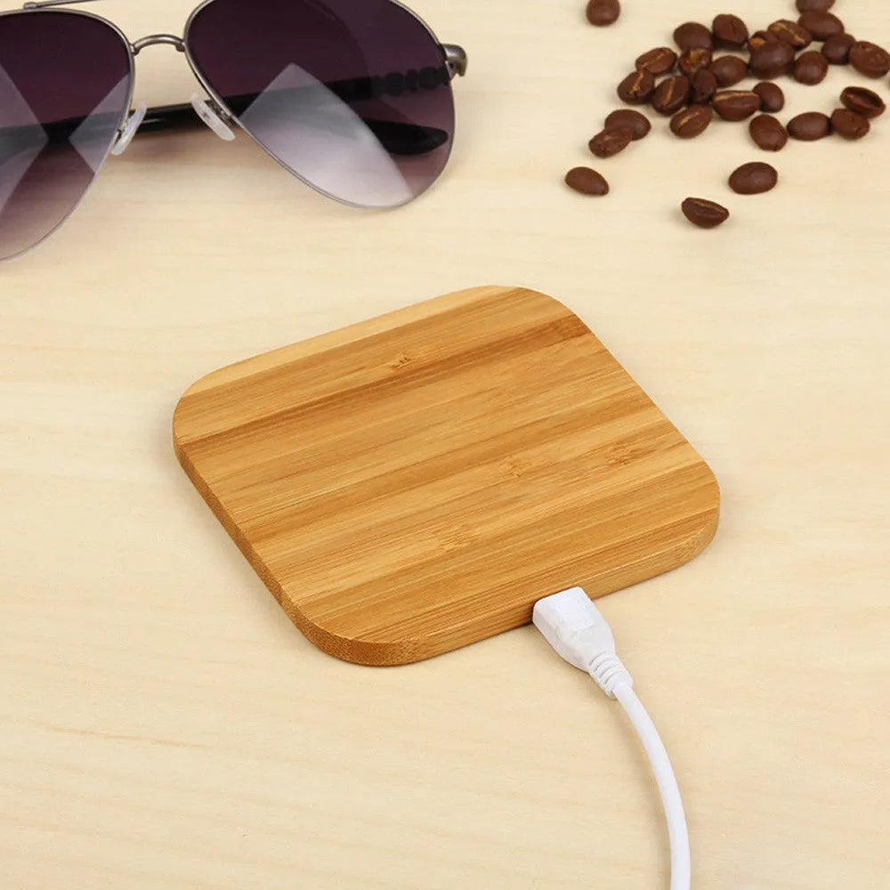 Square bamboo wood 5W wireless charging pad with LED indicator lights.