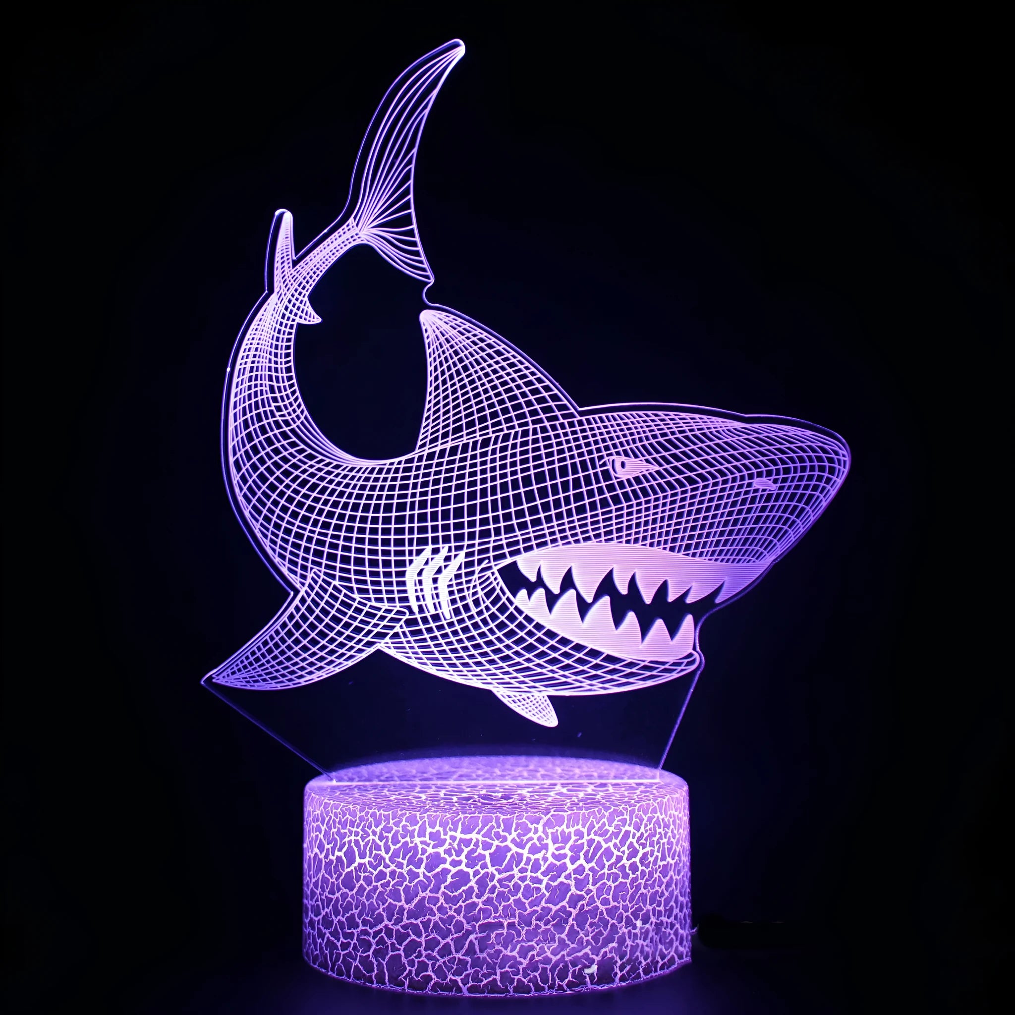 Blue shark-shaped 3D LED night light on a square white base with remote control for 16 colours.