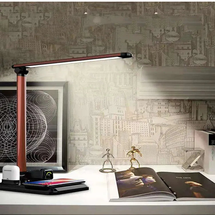 Black and white 4-in-1 LED desk lamp with wireless charging pad and adjustable lighting controls