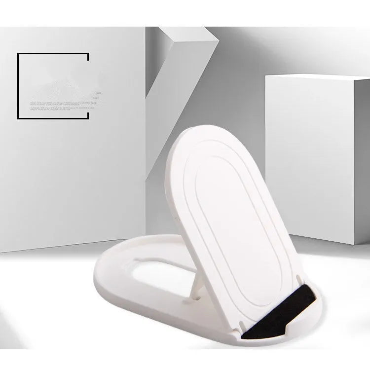 A lazy bracket style mobile phone stand made of plastic, shown in multiple colour options on a wooden desk.