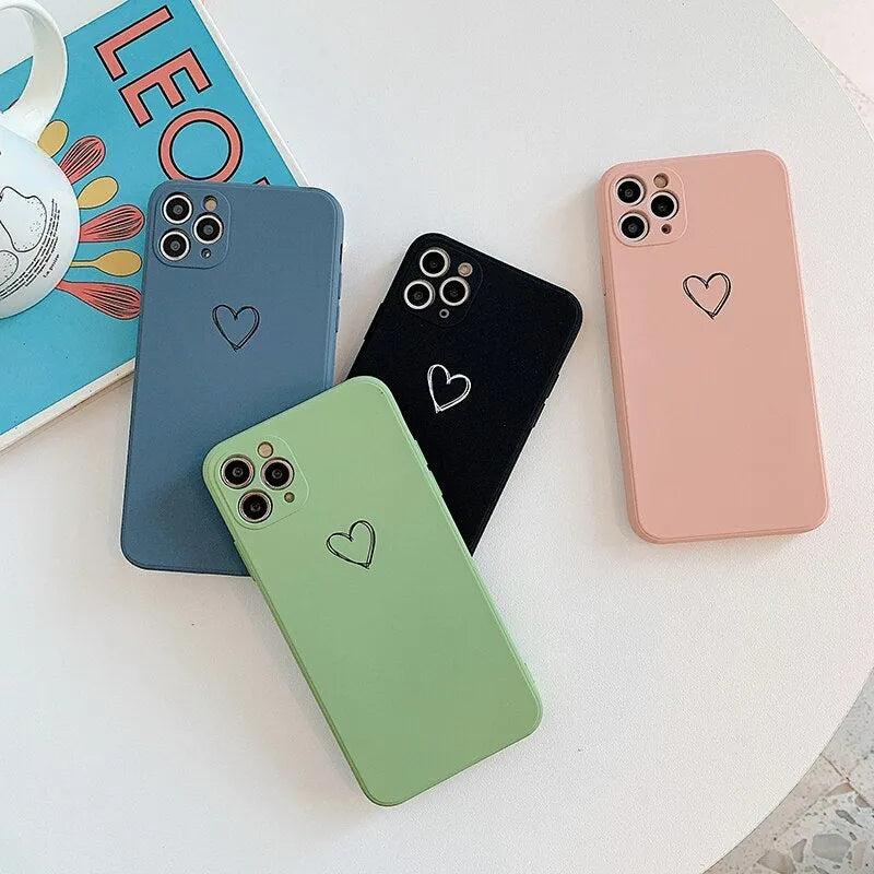 Silicone TPU back cover case for iPhone in solid colours like black, pink, and green on a white background.